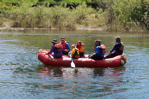 scouts in a boat on the river